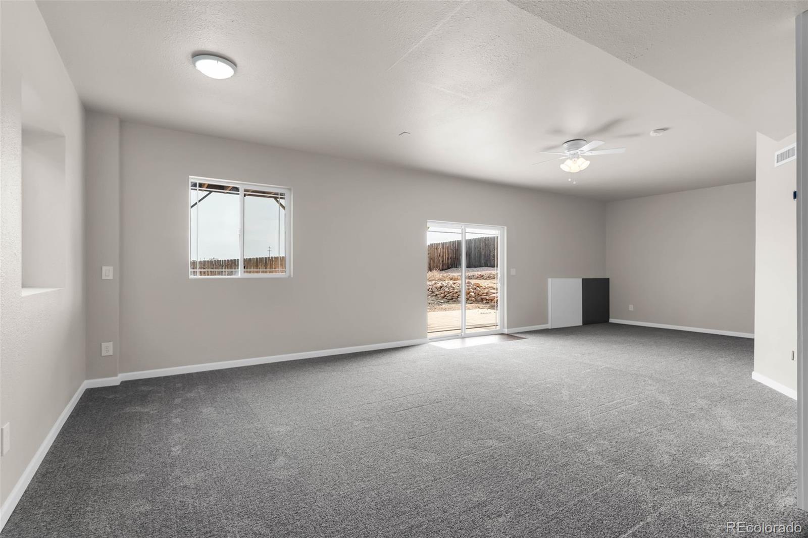 249 High Meadows Drive Florence, CO 81226 - Photo 27 of 47 an empty room with windows and closet