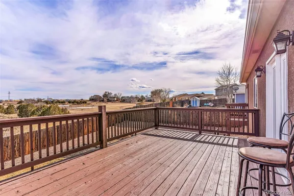a view of a balcony with wooden floor