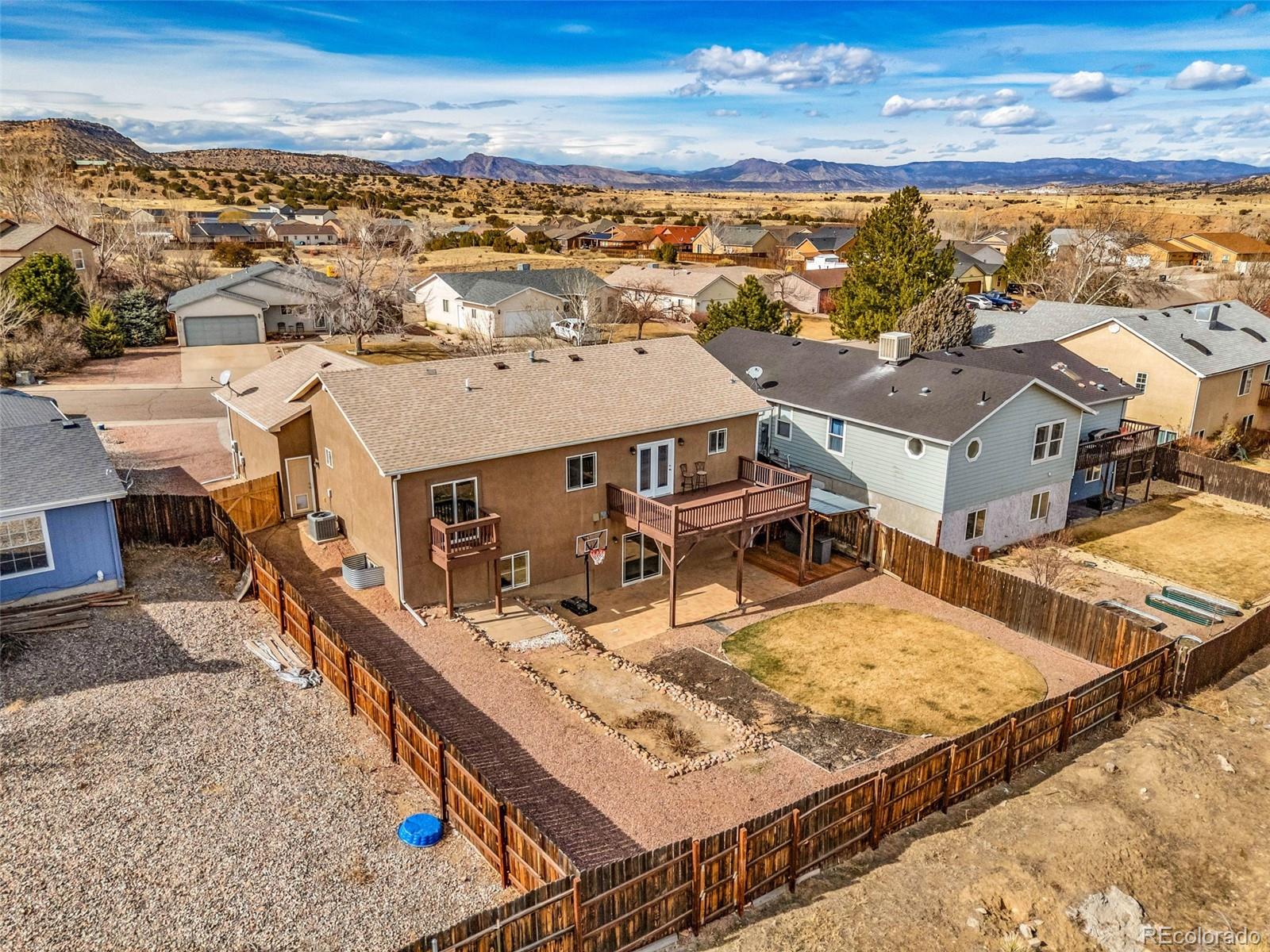 249 High Meadows Drive Florence, CO 81226 - Photo 40 of 47 an aerial view of residential houses with outdoor space