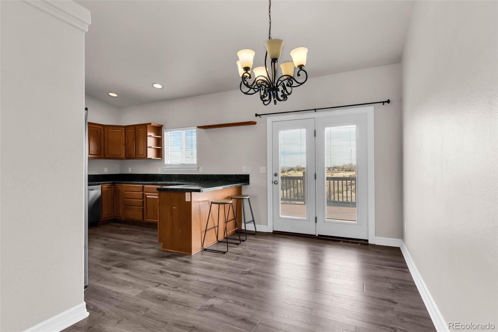 249 High Meadows Drive Florence, CO 81226 - Photo 8 of 47 a view of a kitchen with a sink and chandelier