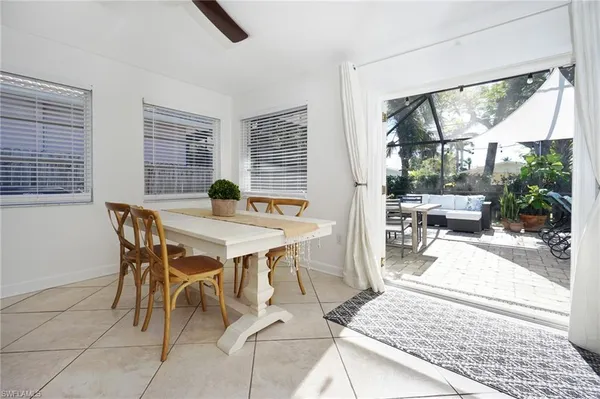 a dining room with furniture and wooden floor
