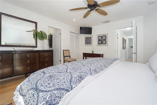 a bedroom with a bed and a dresser