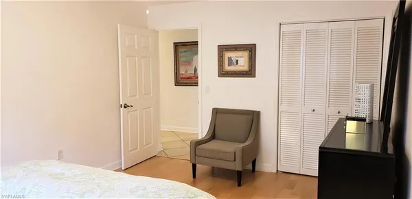 a bedroom with furniture and a window