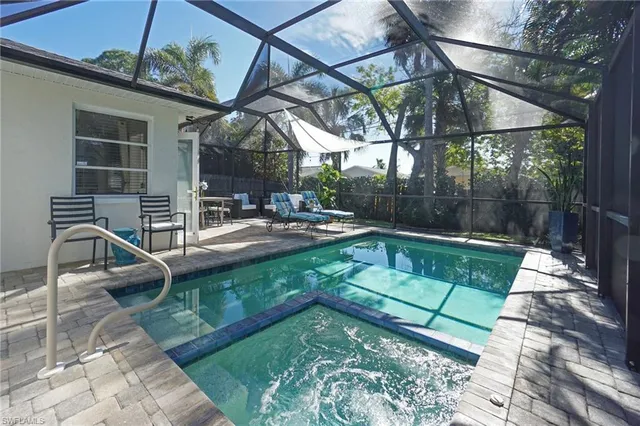 a view of swimming pool with a patio