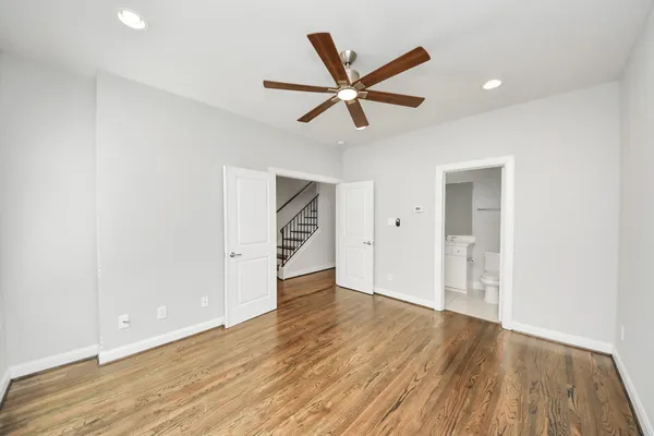 a bathroom with a sink toilet mirror and shower