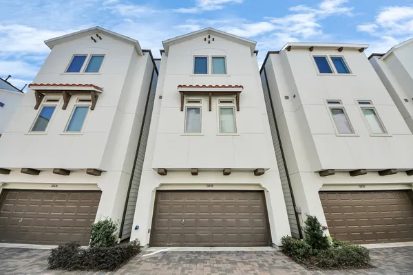 a front view of a house with stairs