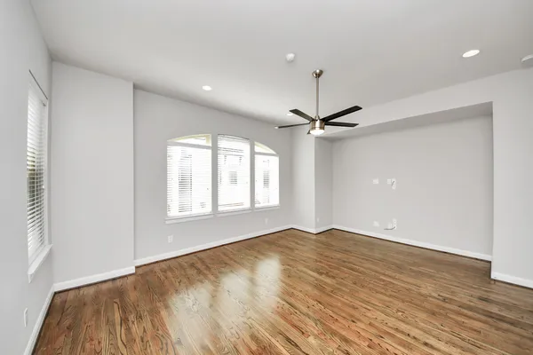 a spacious bathroom with a tub sink and mirror