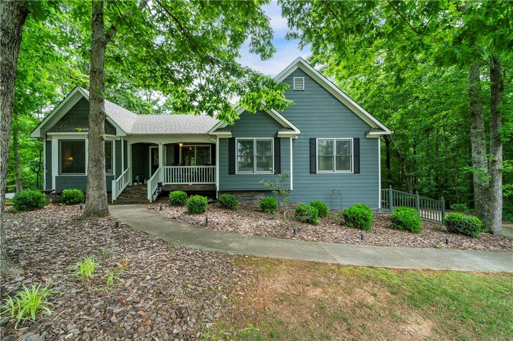 2281 Carlan Road Fairmount, GA 30139 - Photo 1 of 1 a view of a house with a yard plants and large tree