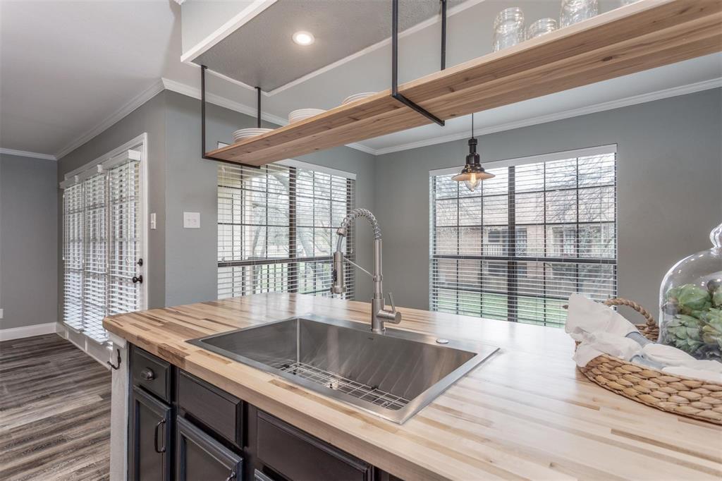 16301 Ledgemont Lane, Unit 283 Addison, TX 75001 - Photo 6 of 16 Kitchen opens to dining area and allows for lots of natural light to fill the space.