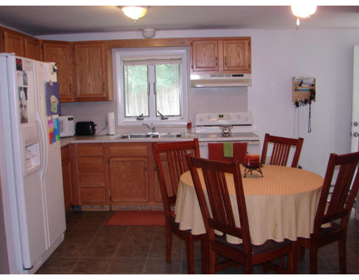49 Finch Road Springfield, MA 01119 - Photo 4 of 7 a dining table with chairs and cabinets