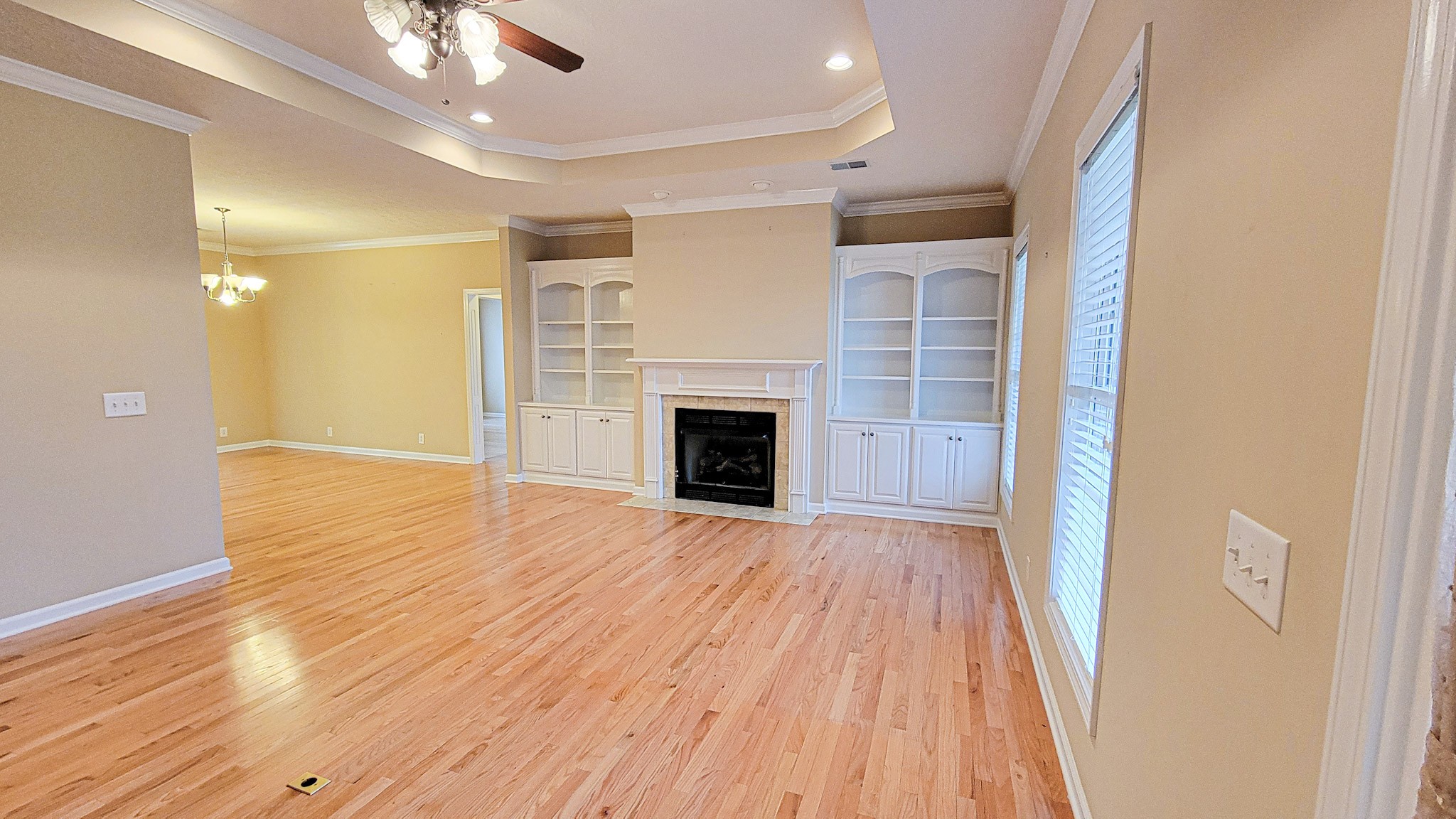 4200 Sandy Springs Road Springfield, TN 37172 - Photo 16 of 34 wooden floor in an empty room with a fireplace