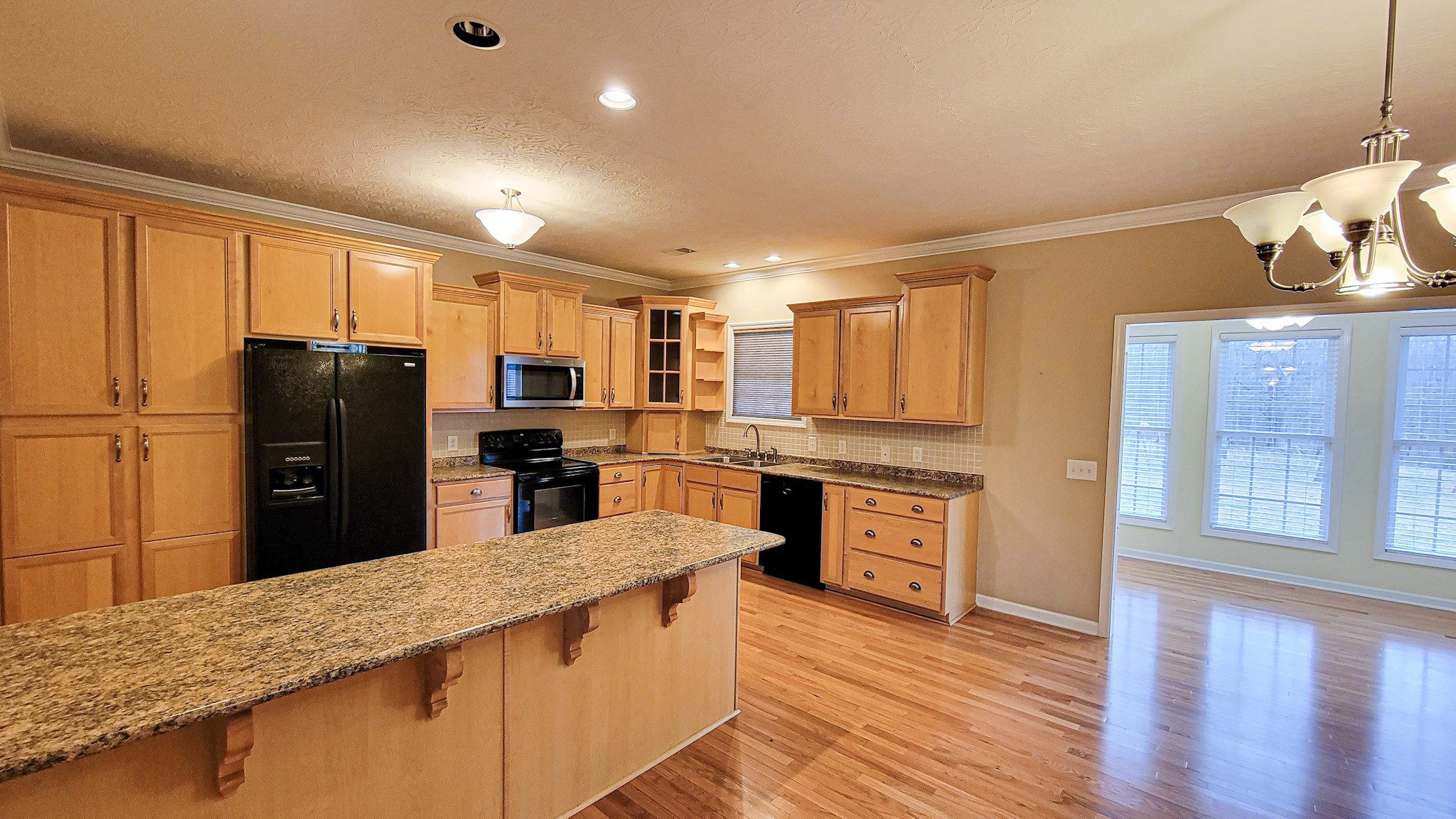 4200 Sandy Springs Road Springfield, TN 37172 - Photo 19 of 34 a kitchen with stainless steel appliances granite countertop a refrigerator a stove top oven and a sink