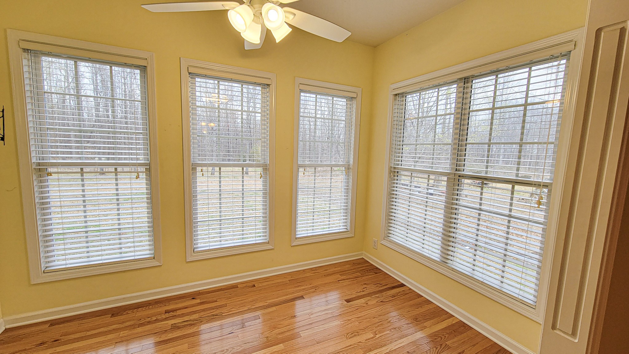 4200 Sandy Springs Road Springfield, TN 37172 - Photo 22 of 34 a view of an empty room with a window and wooden floor