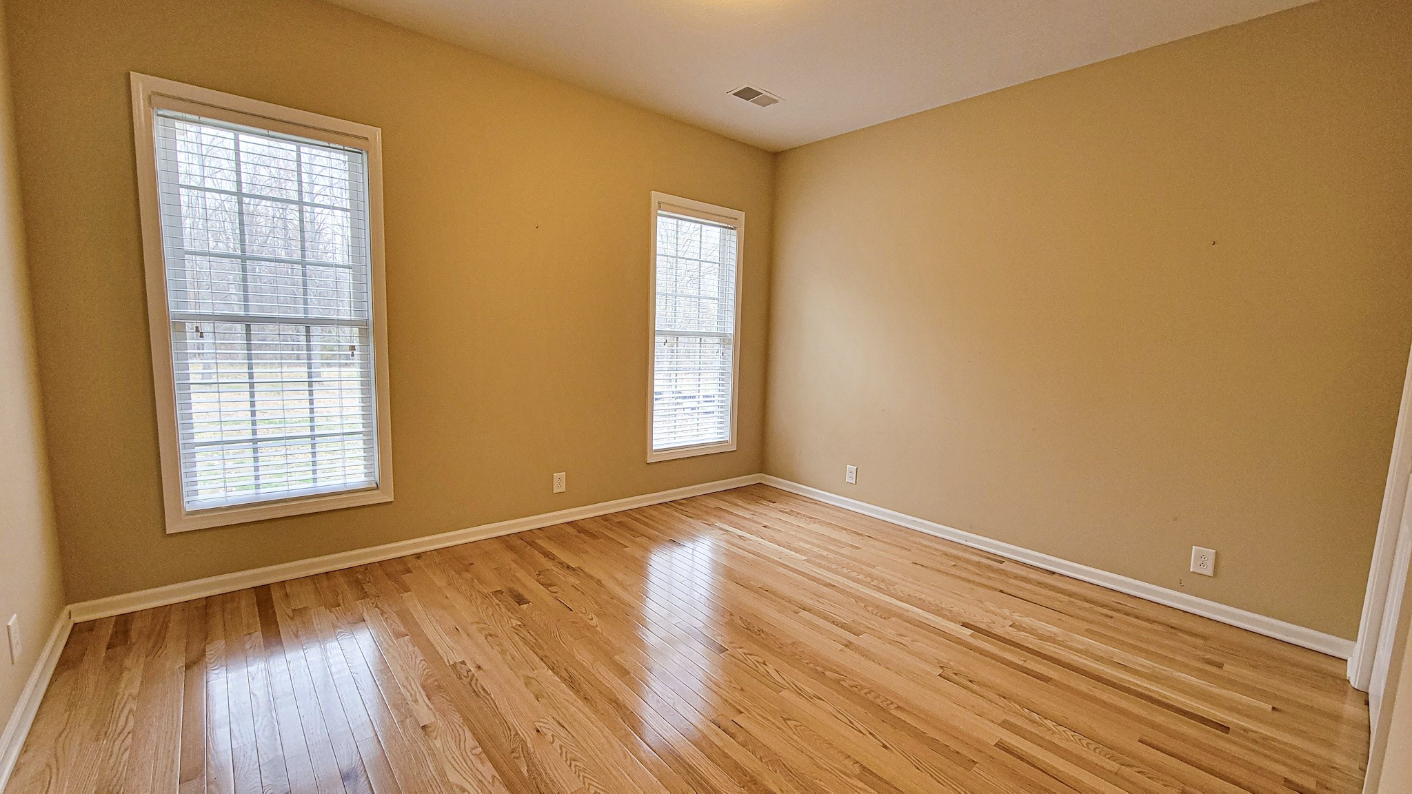 4200 Sandy Springs Road Springfield, TN 37172 - Photo 23 of 34 an empty room with wooden floor and windows