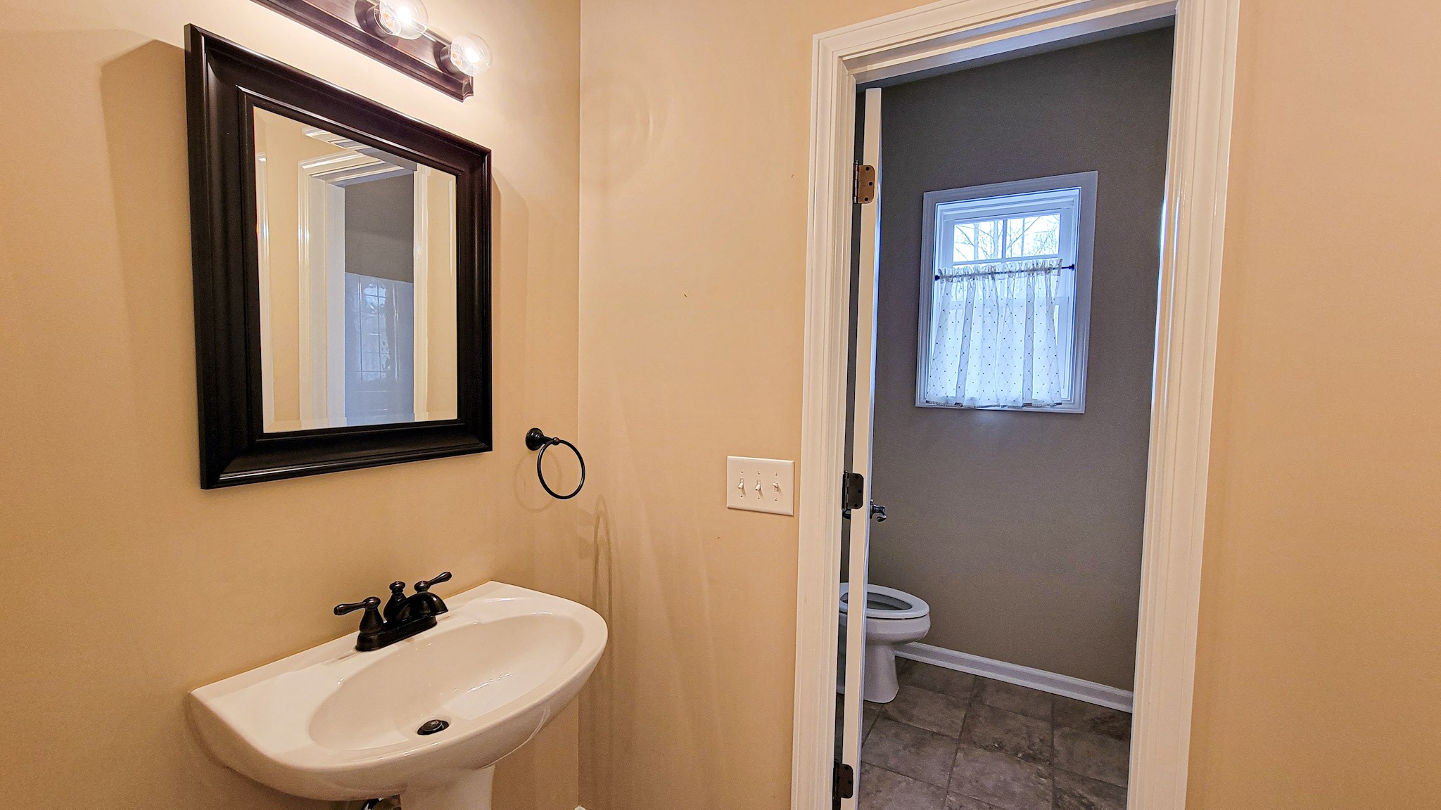 4200 Sandy Springs Road Springfield, TN 37172 - Photo 24 of 34 a bathroom with a toilet a sink and mirror