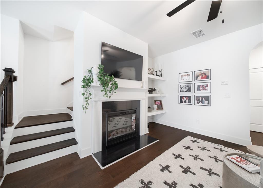 6350 Princeton Ridge Drive Lithonia, GA 30058 - Photo 11 of 45 a living room with furniture and a fireplace