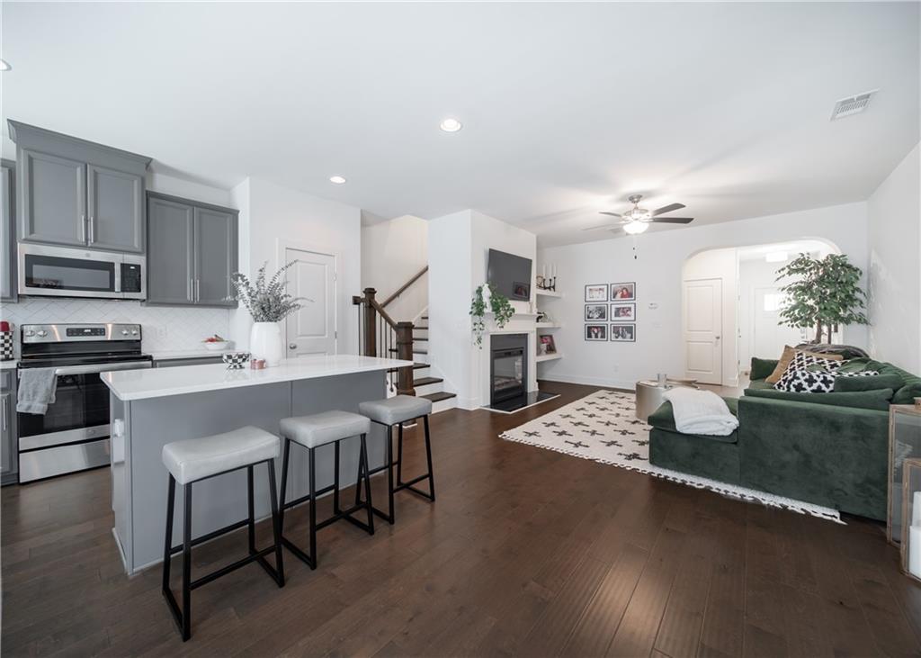 6350 Princeton Ridge Drive Lithonia, GA 30058 - Photo 16 of 45 a kitchen with granite countertop lots of counter top space appliances and furniture