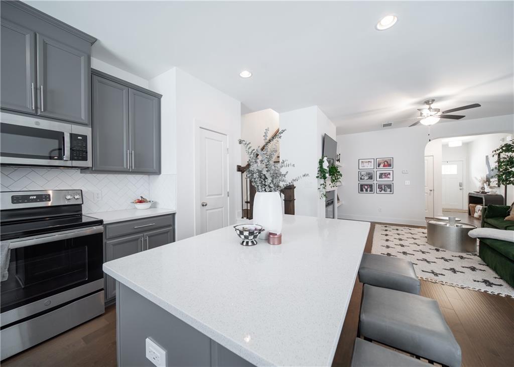 6350 Princeton Ridge Drive Lithonia, GA 30058 - Photo 19 of 45 a view of kitchen with sink stove top oven and microwave