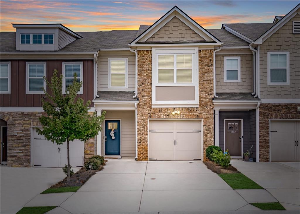 6350 Princeton Ridge Drive Lithonia, GA 30058 - Photo 2 of 45 front view of a house with a yard and potted plants