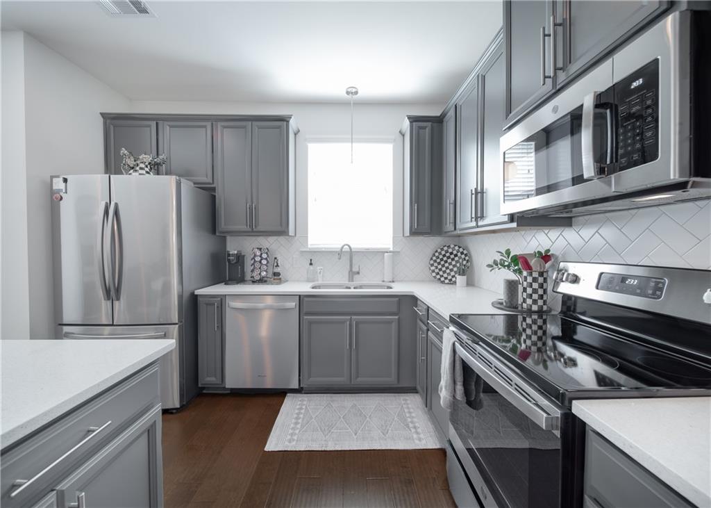 6350 Princeton Ridge Drive Lithonia, GA 30058 - Photo 21 of 45 a kitchen with a sink stove and refrigerator