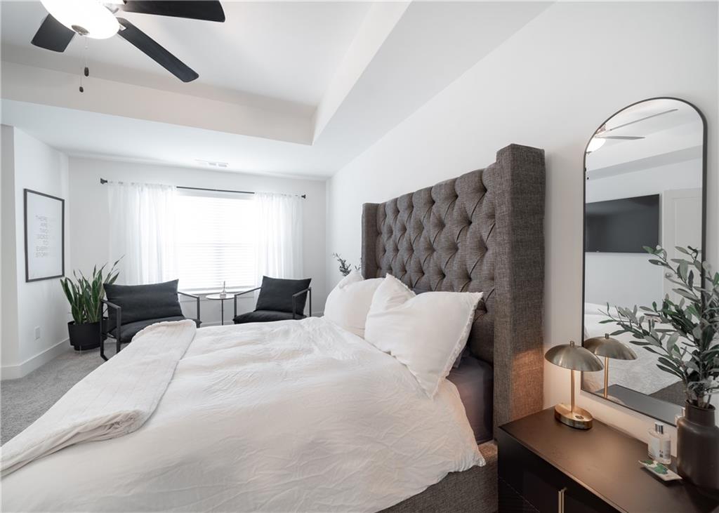 6350 Princeton Ridge Drive Lithonia, GA 30058 - Photo 27 of 45 a bedroom with a bed and a large window