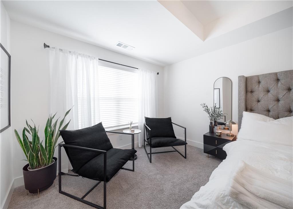 6350 Princeton Ridge Drive Lithonia, GA 30058 - Photo 29 of 45 a living room with furniture potted plant with a table and chair