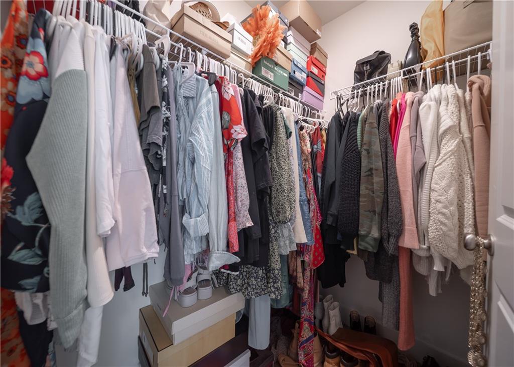 6350 Princeton Ridge Drive Lithonia, GA 30058 - Photo 34 of 45 a view of walk in closet with clothes and shoes