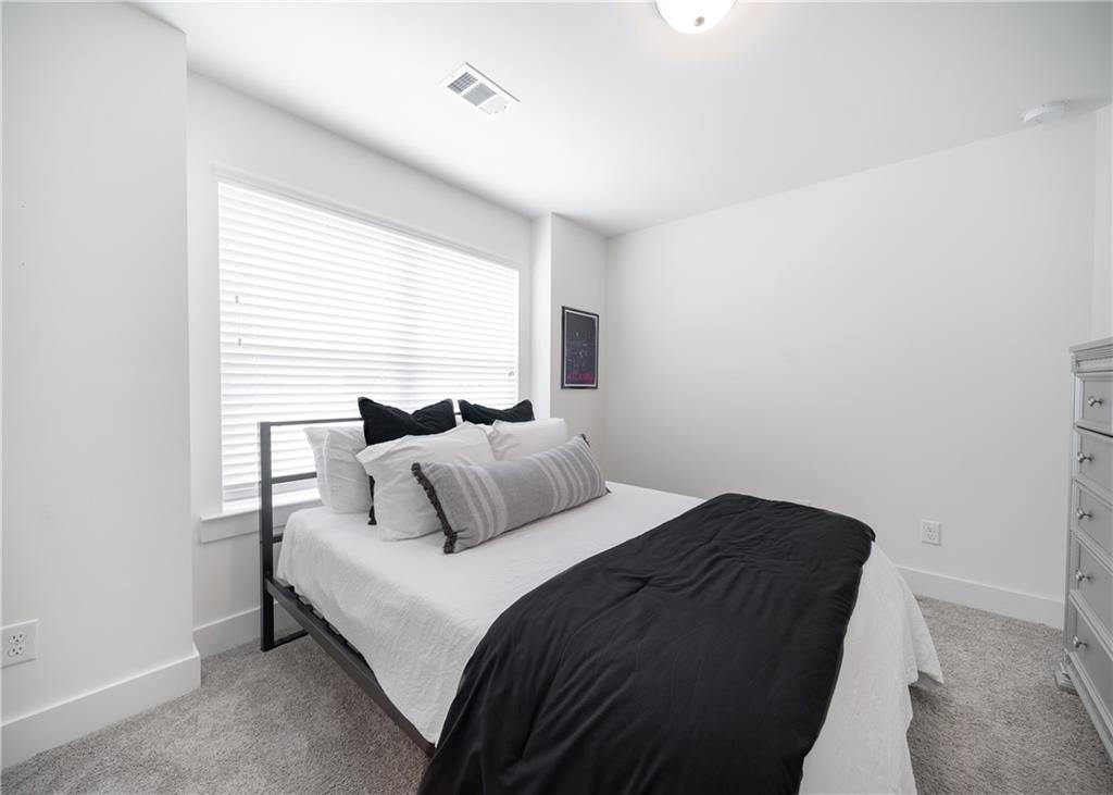 6350 Princeton Ridge Drive Lithonia, GA 30058 - Photo 35 of 45 a bedroom with a bed and a window