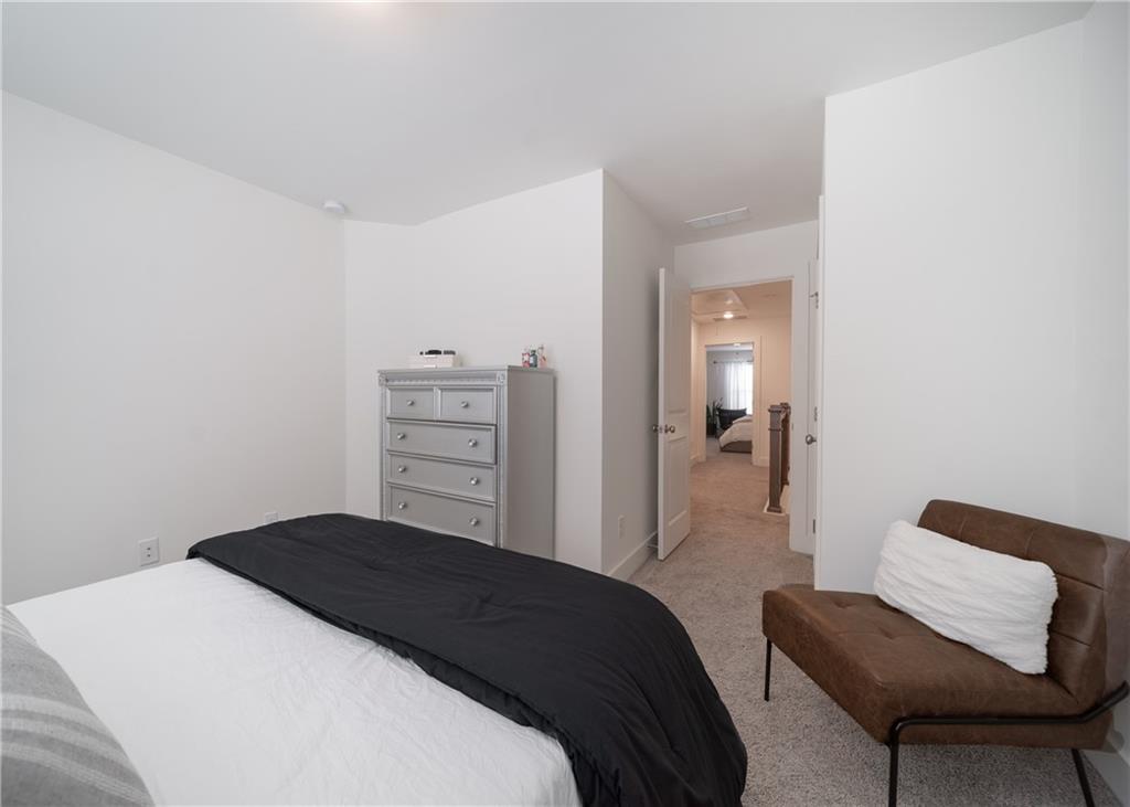 6350 Princeton Ridge Drive Lithonia, GA 30058 - Photo 36 of 45 a bedroom with a bed and chair