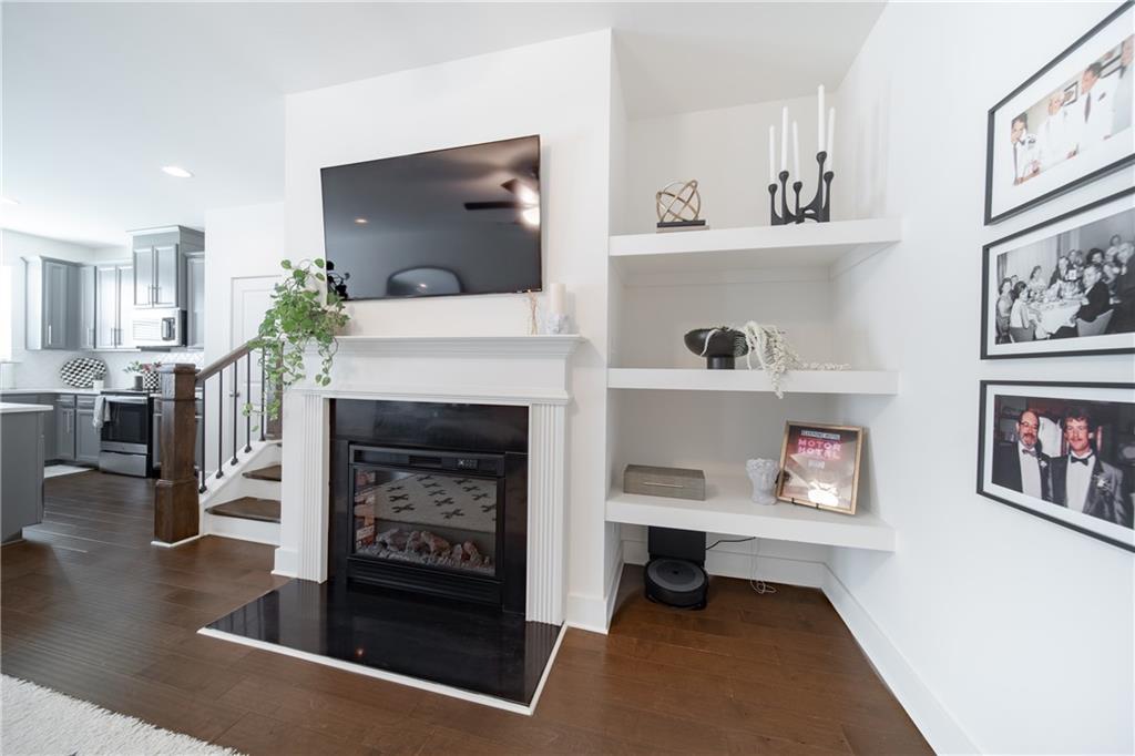 6350 Princeton Ridge Drive Lithonia, GA 30058 - Photo 8 of 45 a living room with furniture and a fireplace