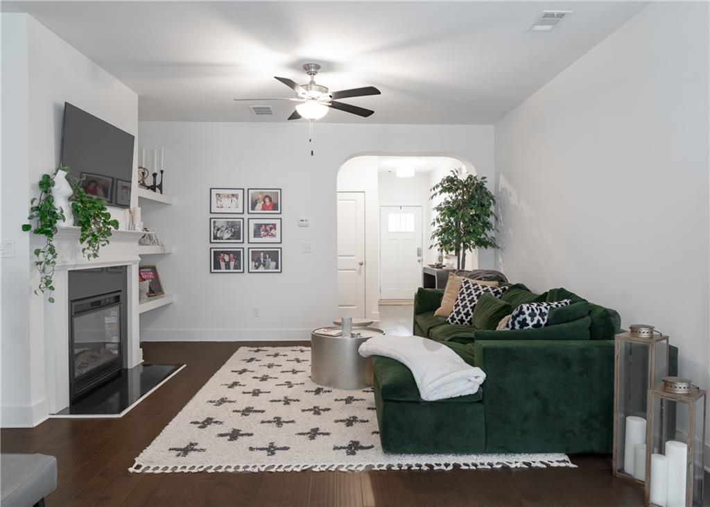 6350 Princeton Ridge Drive Lithonia, GA 30058 - Photo 10 of 45 a living room with furniture and a chandelier