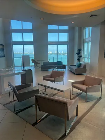 a table with a vase and a lamp on it