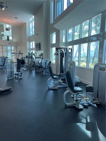 a living room with furniture window and a flat screen tv