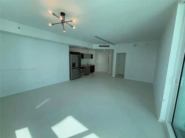 a view of empty room with fireplace