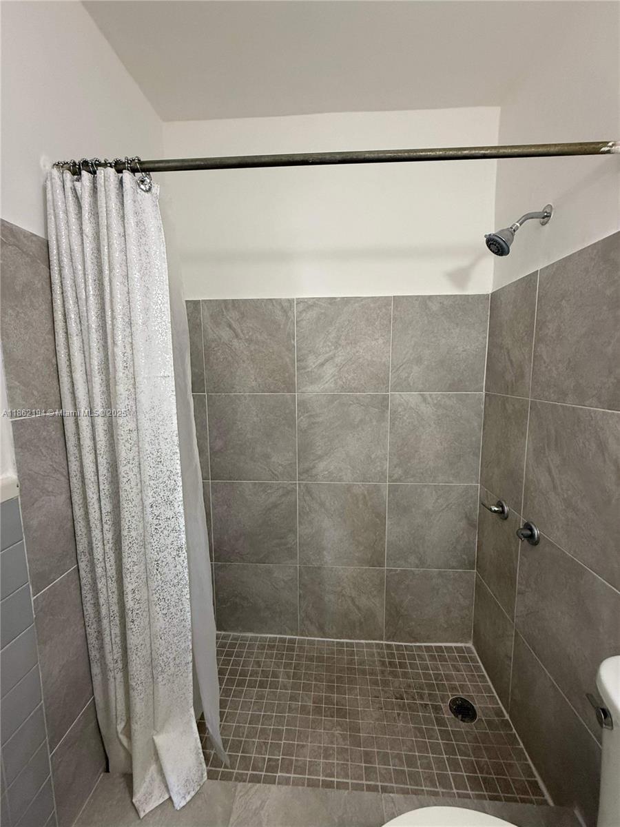 361 Sharar Avenue, Unit 1 Opa-Locka, FL 33054 - Photo 11 of 11 a bathroom with a shower