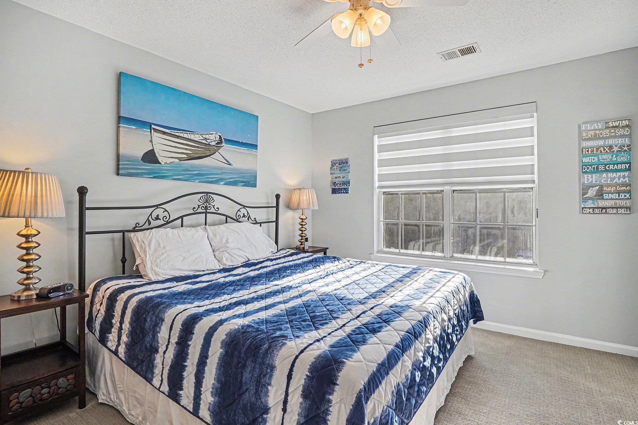 3756 Citation Way, Unit 926 Myrtle Beach, SC 29577 - Photo 12 of 35 Bedroom with carpet flooring, a textured ceiling, and ceiling fan