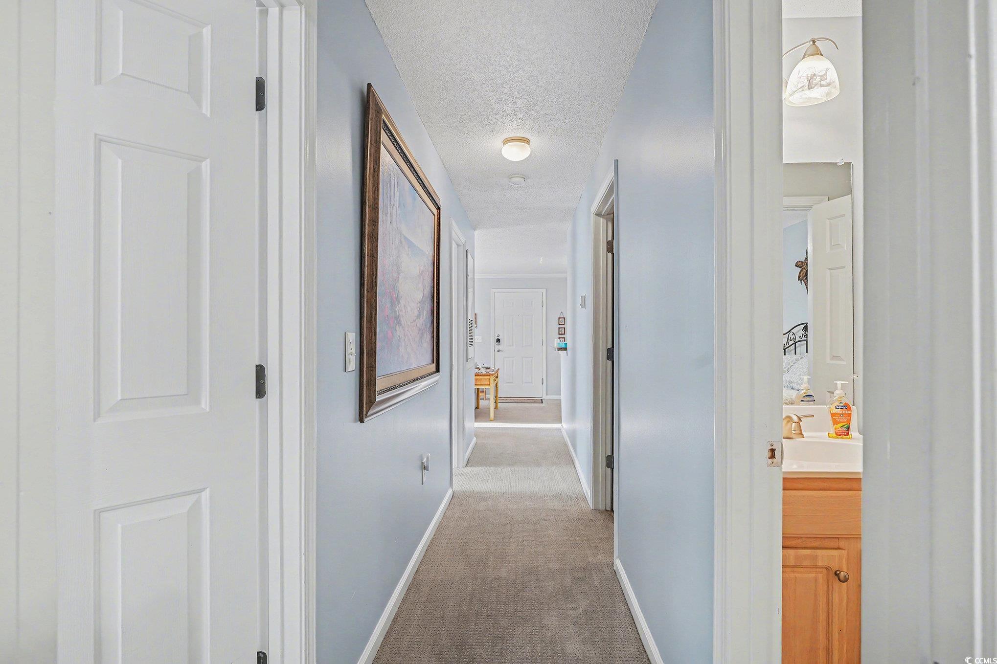 3756 Citation Way, Unit 926 Myrtle Beach, SC 29577 - Photo 16 of 35 Hallway with light carpet and a textured ceiling