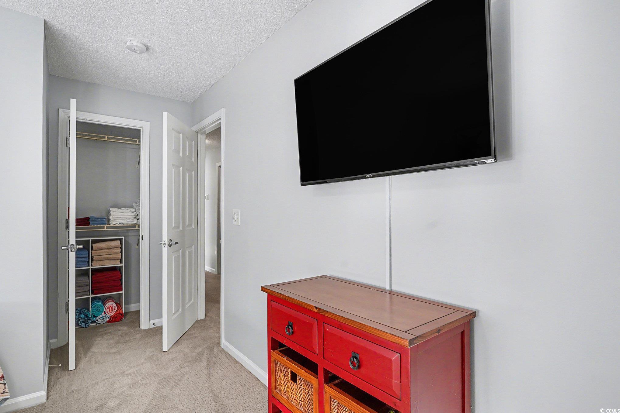 3756 Citation Way, Unit 926 Myrtle Beach, SC 29577 - Photo 23 of 35 Hall with light carpet and a textured ceiling