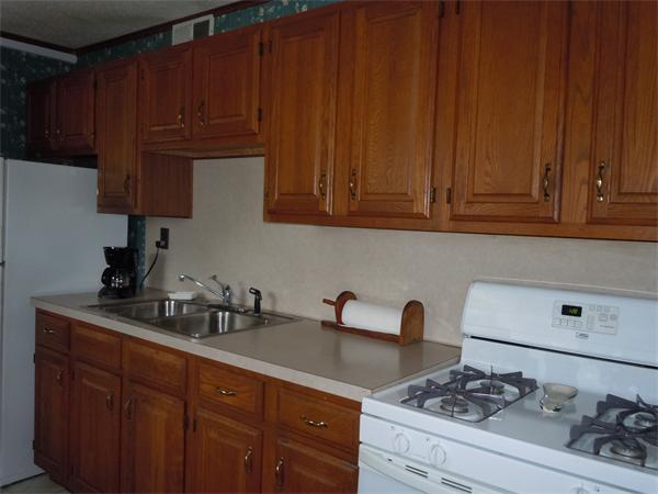 45 Ramah Street Springfield, MA 01104 - Photo 4 of 9 a kitchen with granite countertop wood cabinets and stainless steel appliances