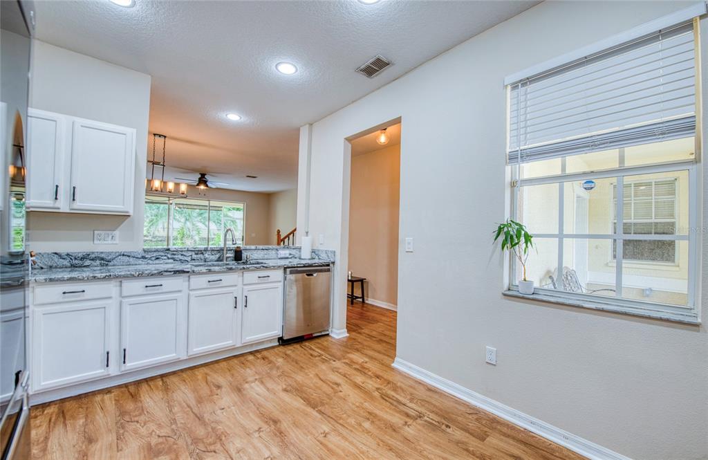 648 Spring Lake Circle Tarpon Springs, FL 34688 - Photo 11 of 30 a bathroom with granite countertop a granite countertop sink and a mirror