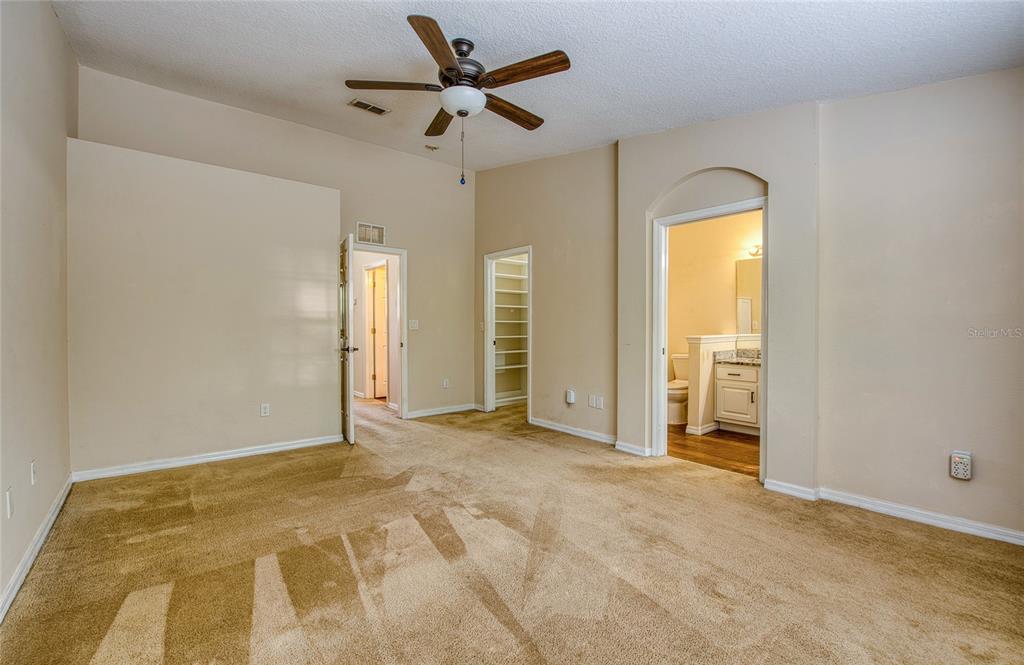 648 Spring Lake Circle Tarpon Springs, FL 34688 - Photo 16 of 30 a view of room with a ceiling fan