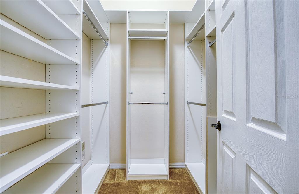 648 Spring Lake Circle Tarpon Springs, FL 34688 - Photo 20 of 30 a view of walk in closet with empty racks