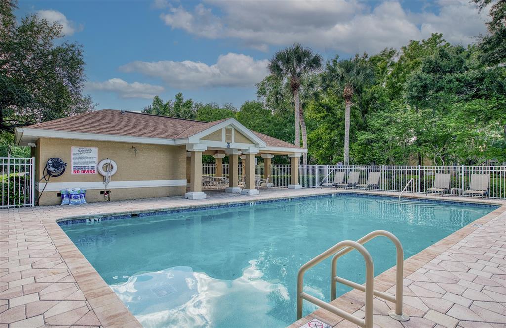 648 Spring Lake Circle Tarpon Springs, FL 34688 - Photo 24 of 30 a view of a house with swimming pool and sitting area