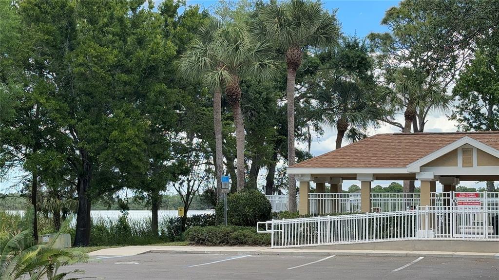 648 Spring Lake Circle Tarpon Springs, FL 34688 - Photo 25 of 30 front view of a house with a garden