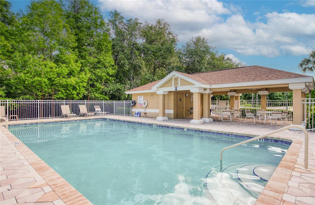 648 Spring Lake Circle Tarpon Springs, FL 34688 - Photo 26 of 30 a view of a house with swimming pool and sitting area