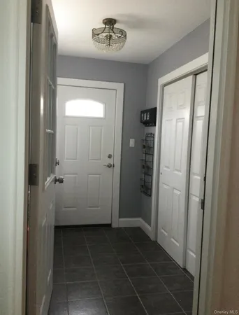 a bathroom with a granite countertop sink a mirror and a shower