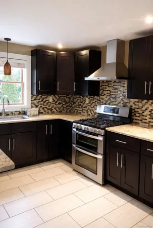 a kitchen with a stove and a sink