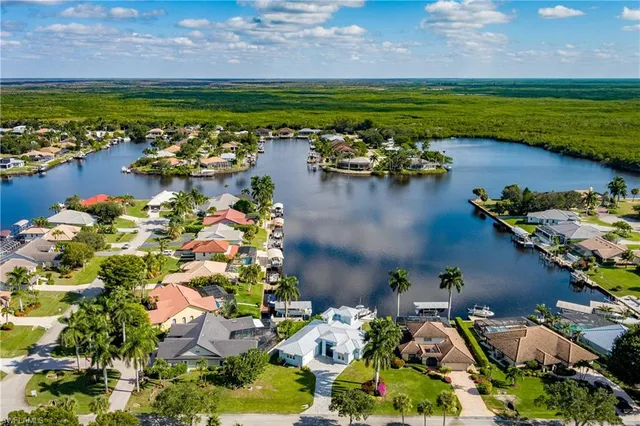 a view of a lake with a house in the background