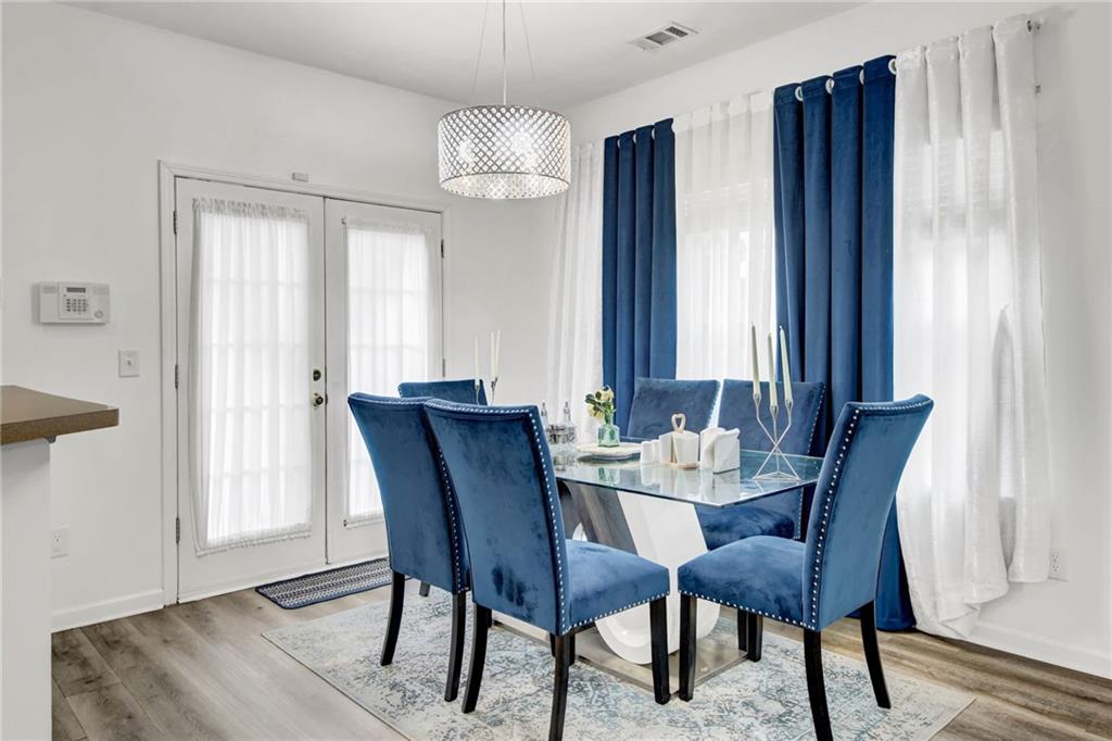 105 Fate Court Dallas, GA 30157 - Photo 14 of 32 a view of a dining room with furniture window and wooden floor