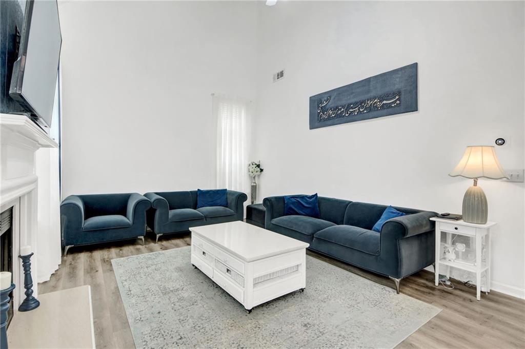 105 Fate Court Dallas, GA 30157 - Photo 17 of 32 a living room with furniture and a fireplace